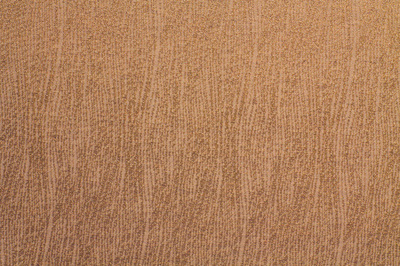 披著波浪的藍綠色羊毛織物與合成纖維織物的對比與融合